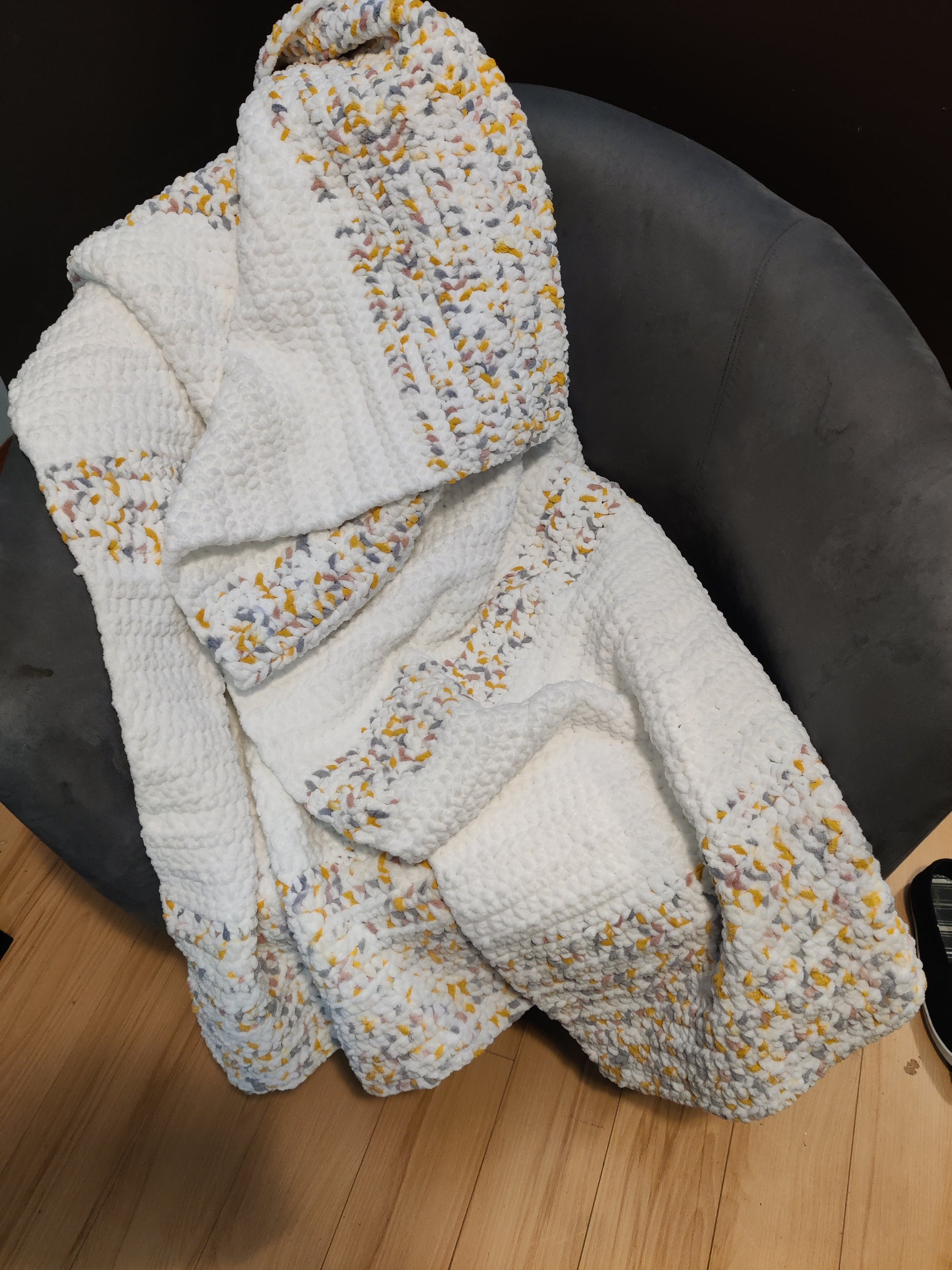 White, pink, yellow, gray, crochet blanket 